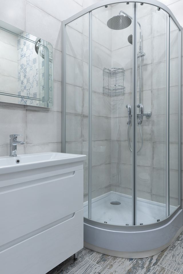 Glass shower cubicle planned around a bathroom layout